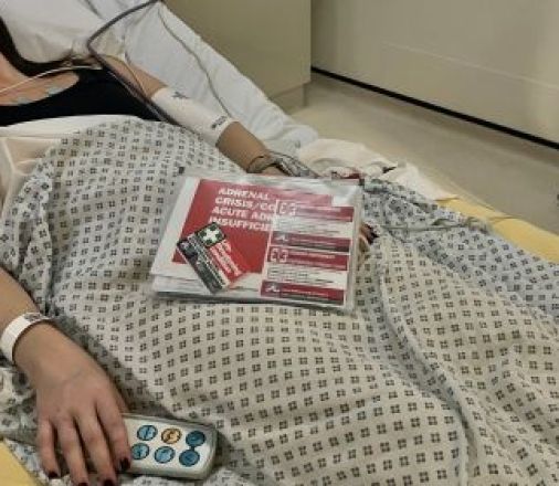 Person in hospital following an adrenal crisis, with ADSHG hospital folder